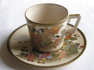Cup and saucer with women, children and flowers, 1900-1920