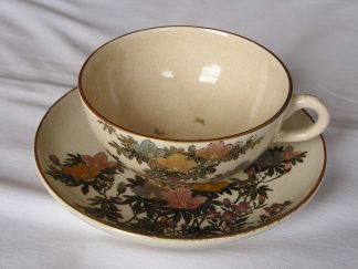 Satsuma cup and saucer with flowers and butterflies, 1900-1912