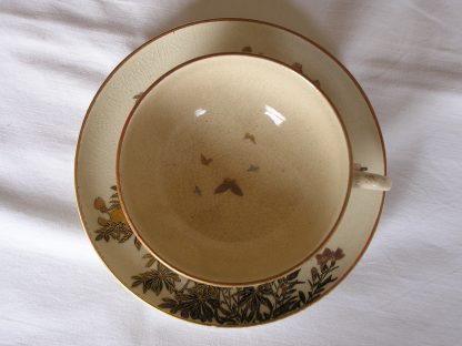 Satsuma cup and saucer with flowers and butterflies, 1900-1912 - Image 2