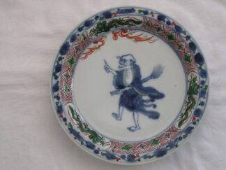 Plate with sage carrying broom, 18th century